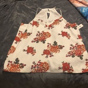 Express thin strap blouse with flower pattern.